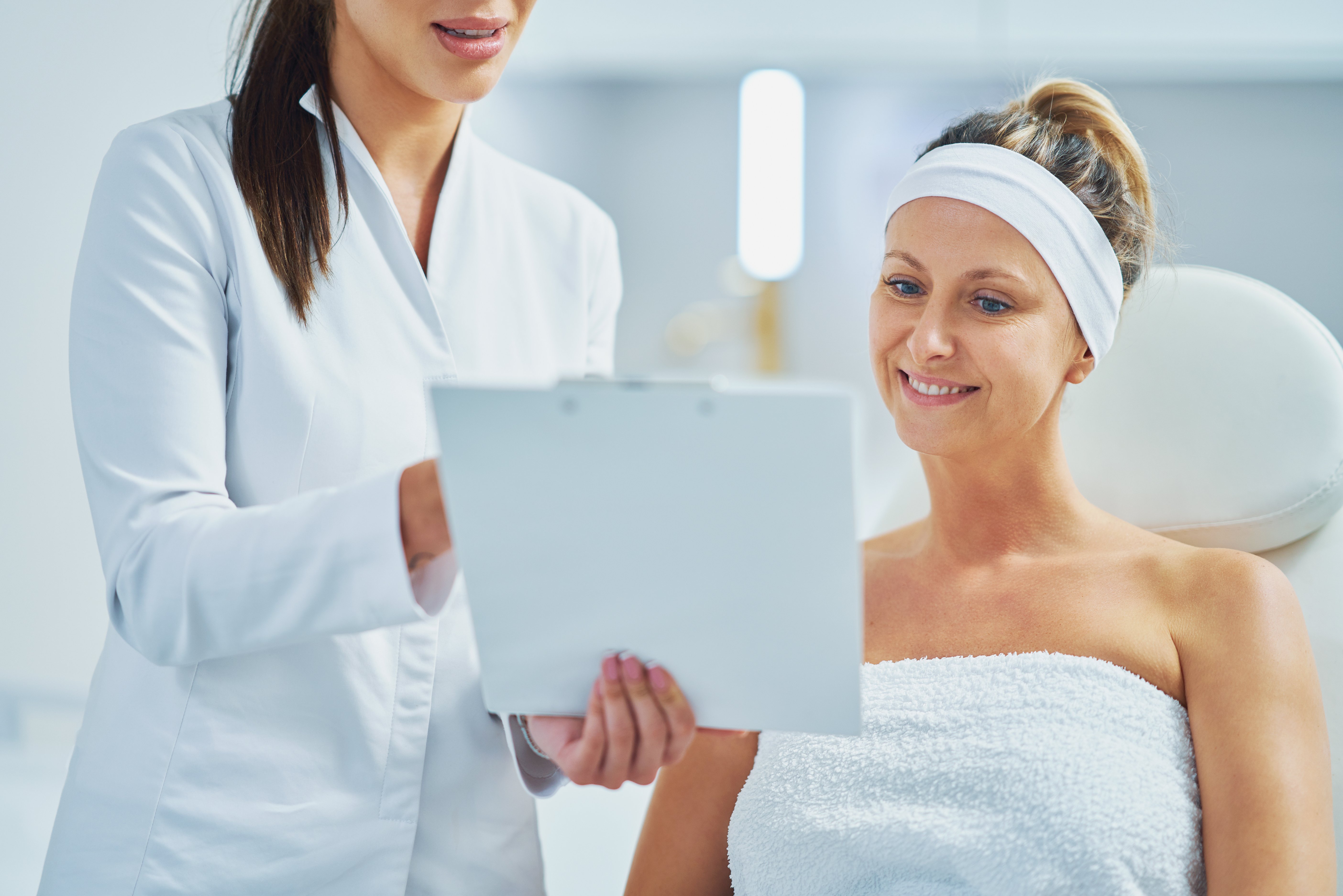 Esthetician tells client what to expect from a chemical peel treatment