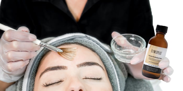 An aesthetician gives a client a safe chemical peel treatment.