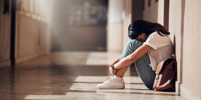 A woman with rosacea suffering from anxiety and depression