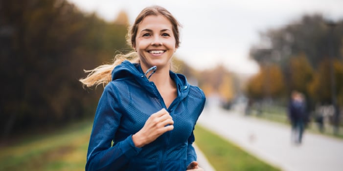 Woman running outside in springtime