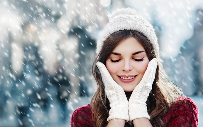 Woman in Winter Weather Touching Face