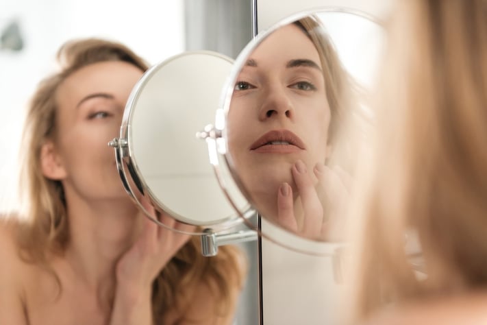 woman applying lip care products