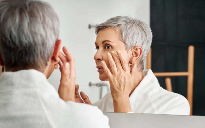 mature woman embracing menopause skin changes