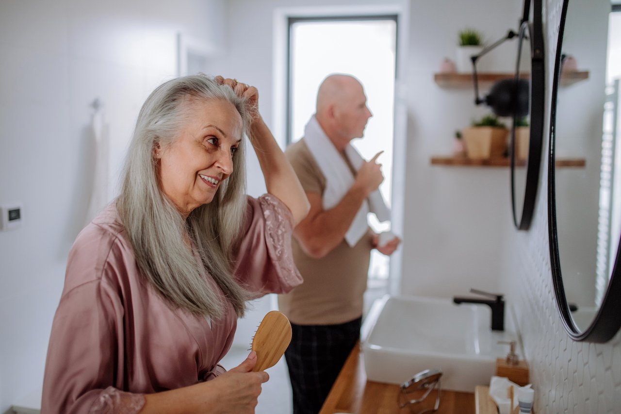 Senior couple getting ready in the morning