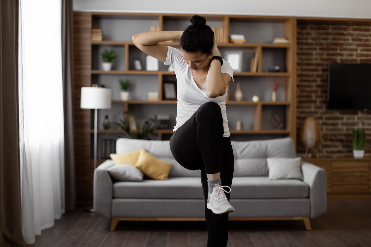 woman exercising at home