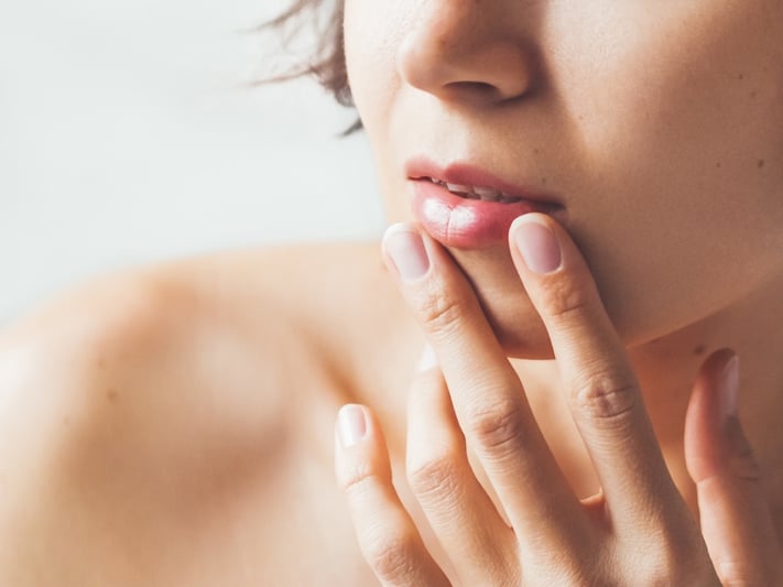woman taking care of her lips