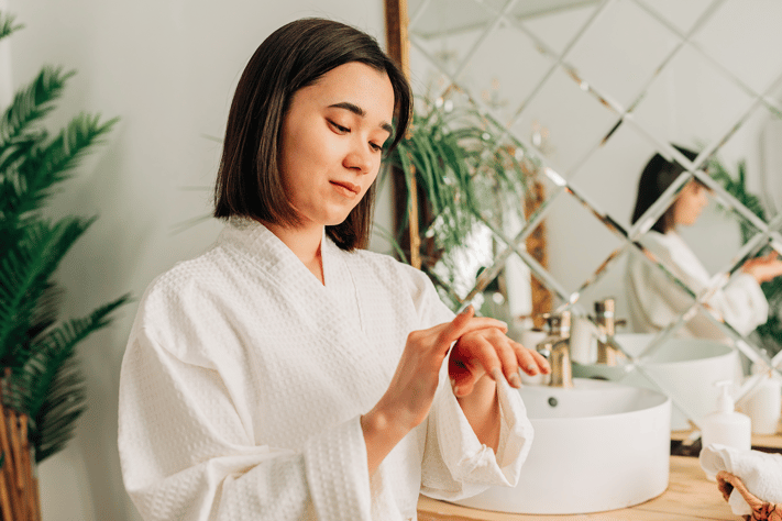 woman applying comfort cream
