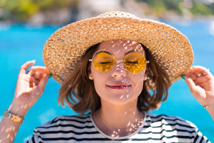 woman protecting skin from sun damage