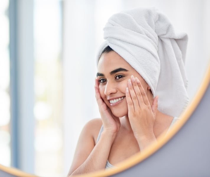 woman applying vitamin-rich skincare