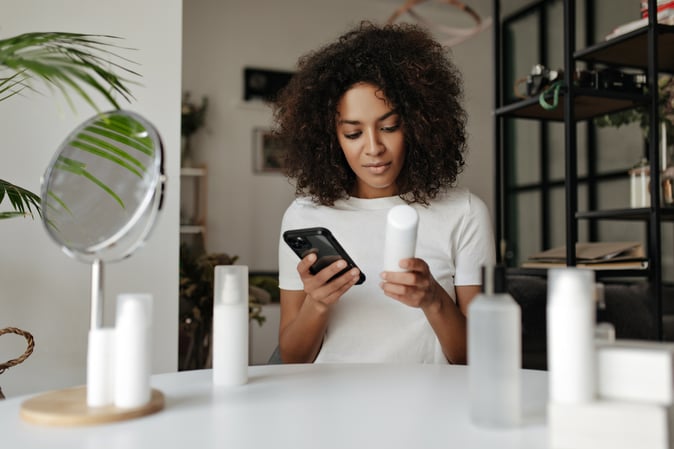 Woman searching skincare ingredients