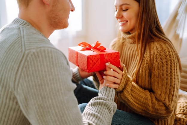 couple exchanging skincare gifts