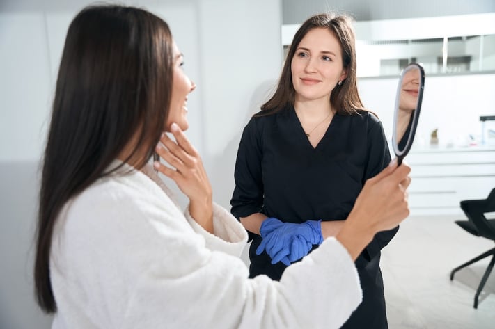 skincare professional discussing different types of chemical peels with client
