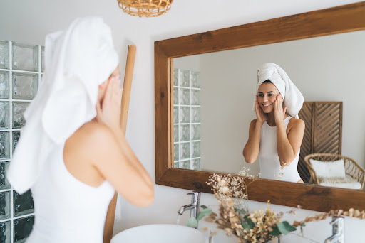 Woman washing face with benzoyl peroxide face wash