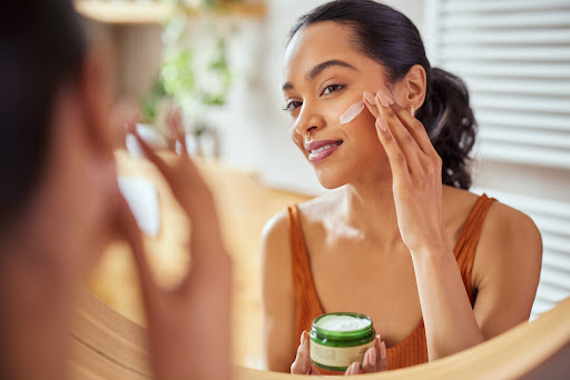 Woman applying salicylic acid products during morning routine